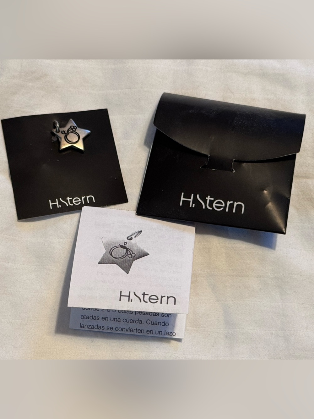 H. Stern Star-Shaped Pewter Pendant Featuring an Engraved  Boleadora